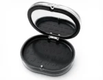 black retainer travel case with built-in mirror and secure storage for retainers, aligners, mouthguards, and dentures.