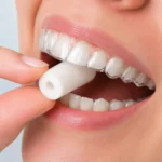 White dental chewie used with clear aligners to improve aligner fit